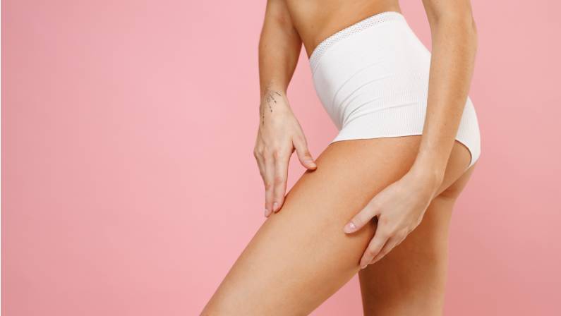 Cropped image side view of a beautiful young woman after thigh lift surgery
