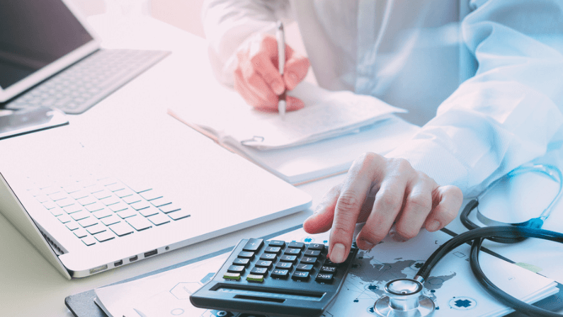 Doctor calculating Male Facelift costs, reviewing procedure details and expenses during patient consultation.
