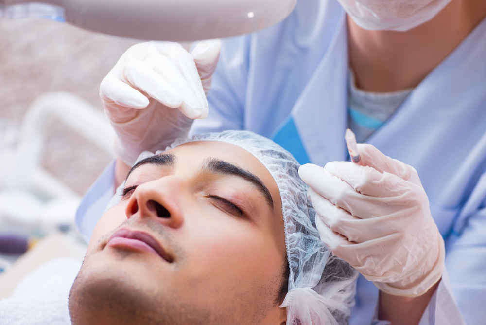 Man visiting doctor for plastic surgery