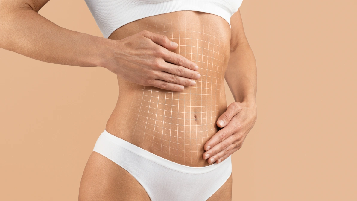 Woman touching smooth abdomen with skin grid pattern showing progress and tone improvement after tummy tuck recovery time.